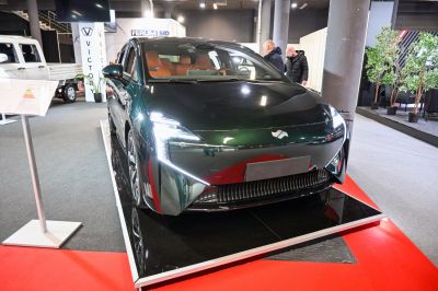 Sleek electric vehicle front with LED headlights and aerodynamic design