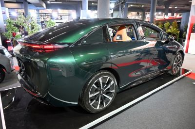 Aerodynamic rear and modern alloy wheels of an electric sedan