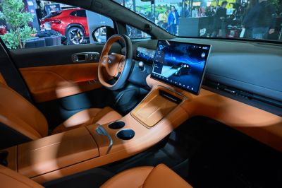 Modern car interior with large touchscreen and brown leather upholstery