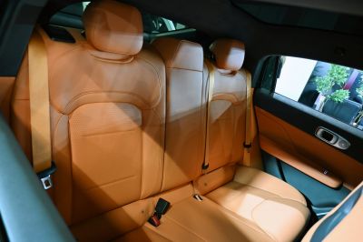 Luxury tan perforated leather rear seats with seat belts