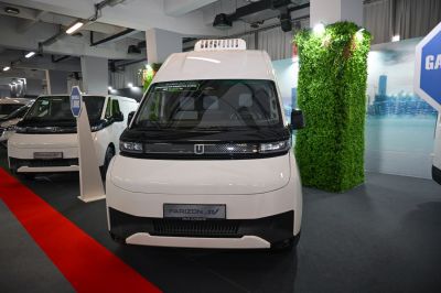 Front view of modern compact electric van with sleek cabin design