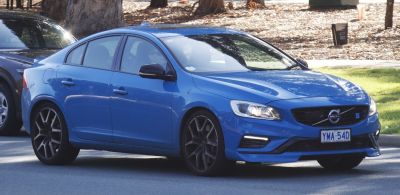 Blue sedan with LED daytime running lights and black alloy wheels