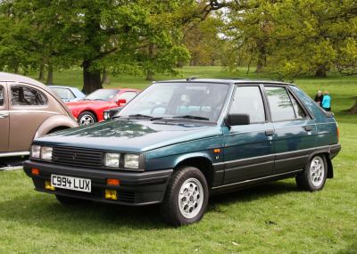 Boxy hatchback with yellow fog lights and multi-spoke alloy wheels