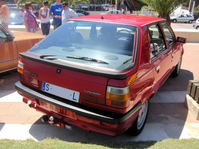 Rear hatchback view with rear wiper and tail lights of a classic 1980s compact car