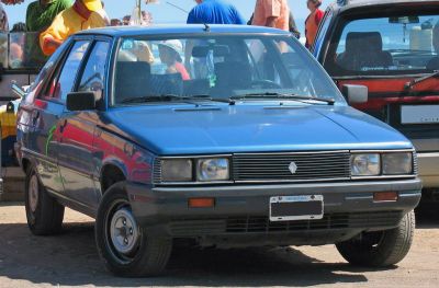 Front view with square headlights and simple grille design.