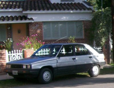 Silver black two-tone hatchback side view parked outdoors