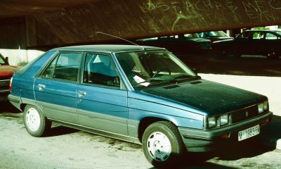 Side profile of a hatchback with rectangular headlights and angular design
