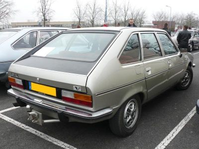 Rear and side view of a vintage hatchback with classic 1970s styling.