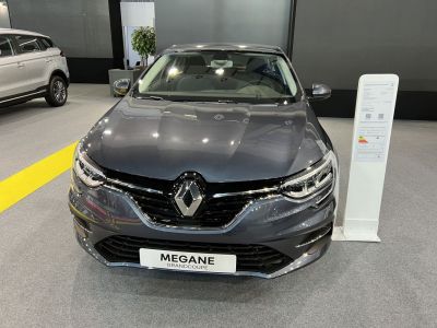 Front view of a sedan with distinctive grille and LED headlights