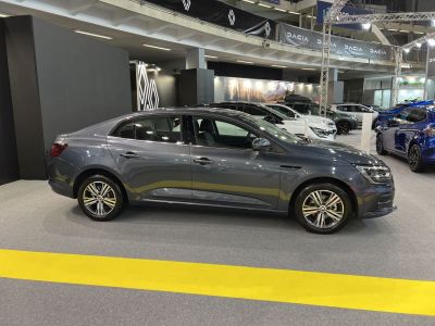 Side view of a modern sedan with sleek design and alloy wheels