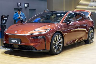 Aerodynamic electric sedan with sleek LED headlights and large alloy wheels