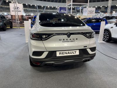 Sleek rear view with LED taillights and sporty bumper in white.