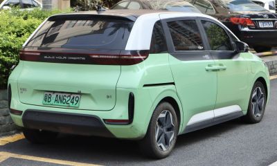 Rear and side view of a compact electric vehicle with distinct light and door design