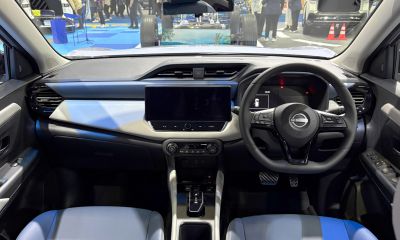 Steering wheel, digital dashboard, central touchscreen, air conditioning controls