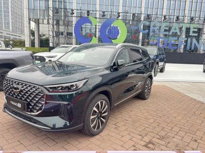 Front and side view of SUV with large grille and sleek design