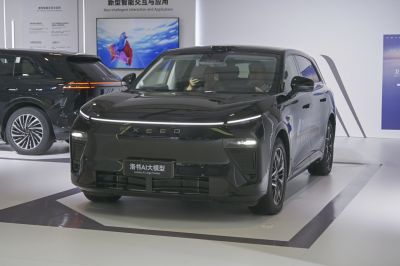 Front view of black SUV with continuous LED light bar and aerodynamic styling