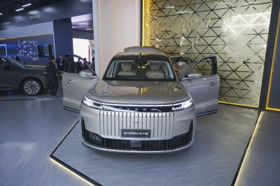 Front view with distinctive grille, LED headlights, and open doors