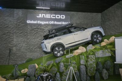 SUV climbing rocky incline with roof rack and ladder
