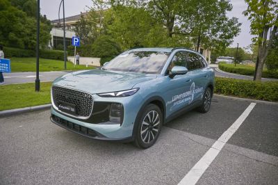 Modern SUV with large diamond pattern grille and slim LED headlights