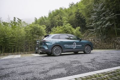 Side profile of 2026 SUV with alloy wheels on mountain road