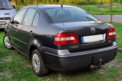 Rear view of compact sedan with distinct tail lights and tow hook