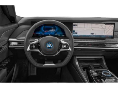 Modern BMW digital dashboard with dual widescreens and multifunction steering wheel