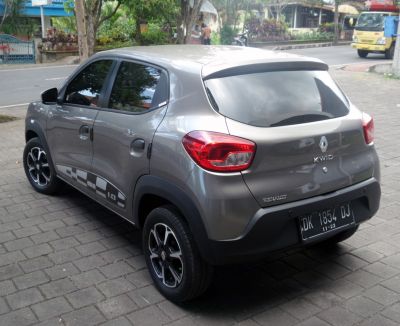 Rear and side view of a compact hatchback with distinct taillights and alloy wheels