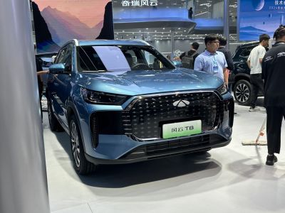 Modern SUV front with large grille and sharp LED headlights
