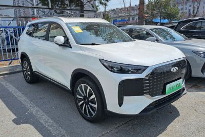White electric SUV with LED headlights and aerodynamic body design