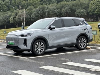 Electric SUV with distinct front grille and charging port