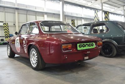 Vintage coupe rear view with round tail lights and racing decals