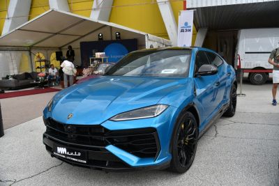 Blue sporty SUV with modern aggressive front fascia and LED headlights