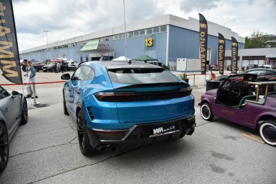 Rear view of blue SUV with quad exhaust and LED taillights
