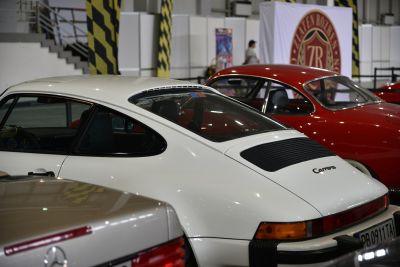 Rear and side view of classic coupe with sloping rear window and Carrera badge