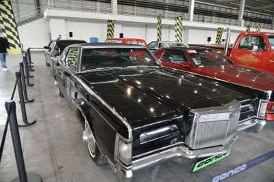 Large luxury sedan with chrome grille and long hood