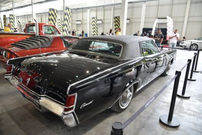 Vintage two-door coupe with vinyl roof and rear fender skirts