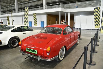 Red classic coupe with curved rear and chrome bumper