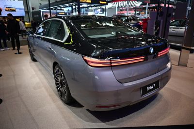 Luxury sedan rear design with sleek taillights and alloy wheels