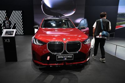 Front grille and LED headlights of a red SUV