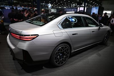 Sleek luxury sedan rear with LED taillights and detailed alloy wheels