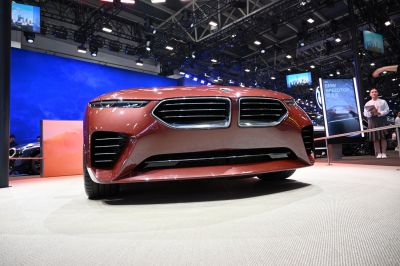 Close-up of futuristic front grille and slim headlights in concept car