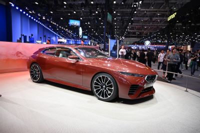 Futuristic fastback car with aerodynamic design and modern wheels