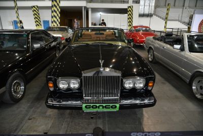 Front view of classic convertible with iconic grille and dual round headlights.