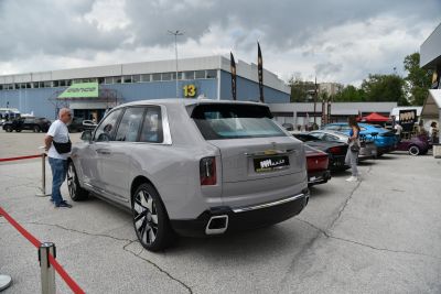 Rear view of luxury SUV with dual exhausts and large alloy wheels