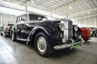 Classic vintage car with chrome grille and round headlights