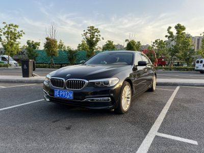 Front and side view of luxury sedan with kidney grille and LED headlights