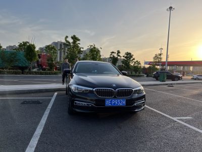 Front view with kidney grille and headlights of a luxury sedan.