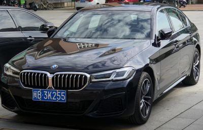 Front view of luxury sedan with kidney grille and LED headlights
