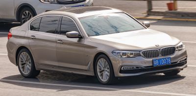 Front side view with headlights and grille of luxury sedan