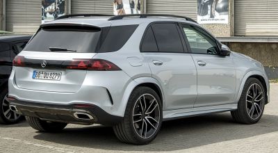 Rear and side view of an SUV with sleek taillights and dual exhaust